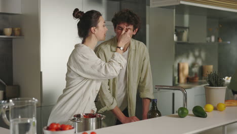 couple cooking and sharing a moment in a modern kitchen