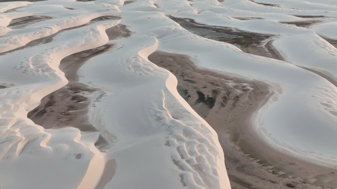 Aerial view of flooded white dunes at Lençóis Maranhenses National Park in Brazil.