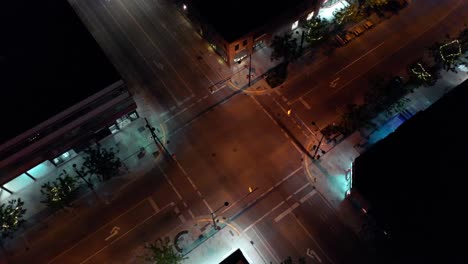 a dark american crossroads with an expensive sports car passing through the video, shot on the dji air 2