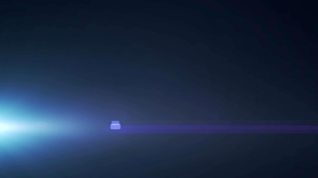 Glowing blue spot of light flickering against black background