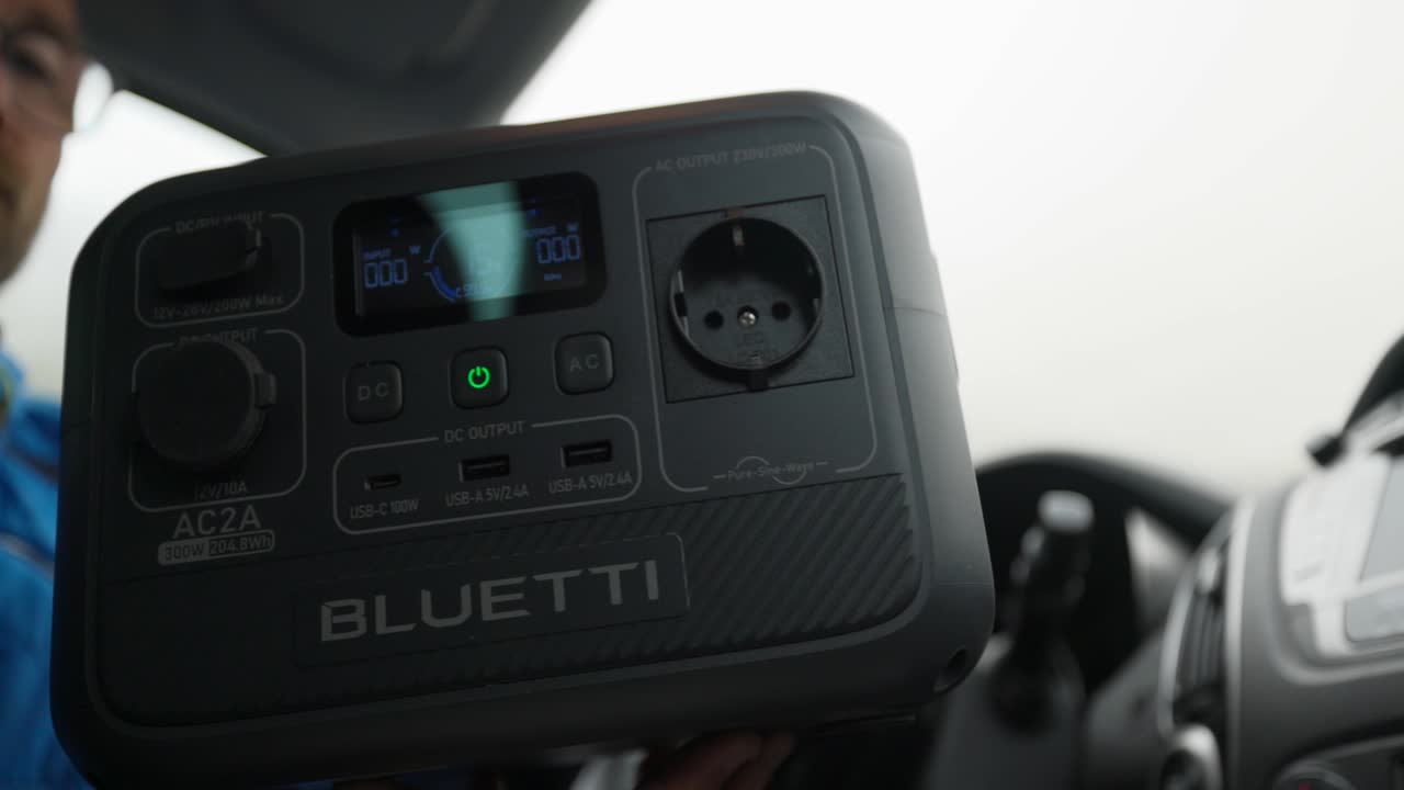 Close up portable power station backup battery charger device for travel inside car