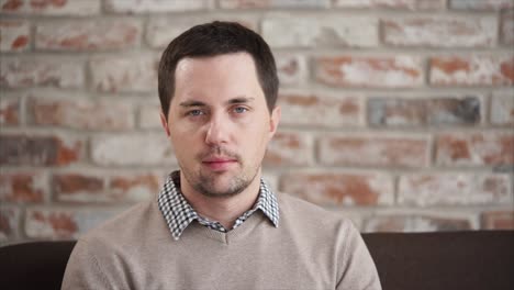 man portrait against brick wall