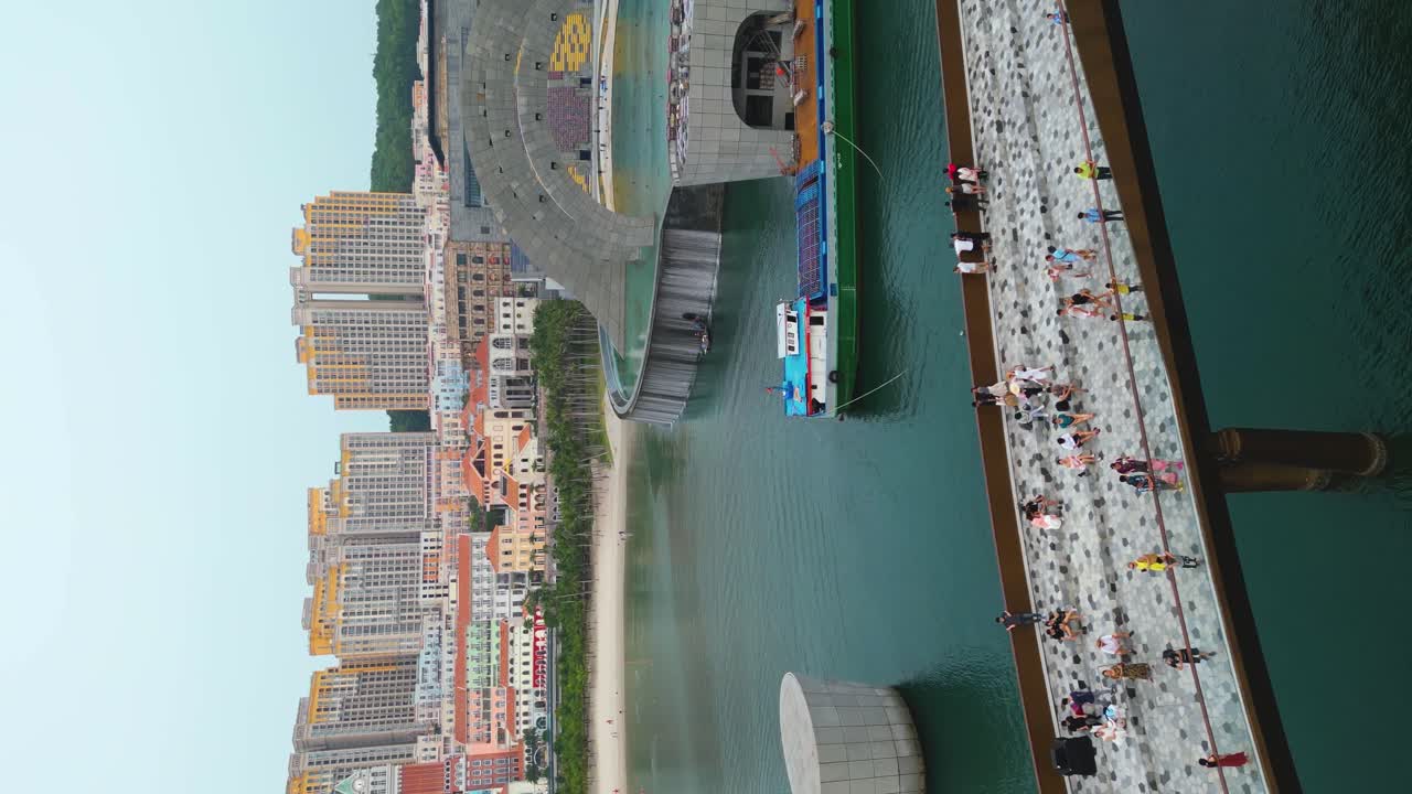 Vertical - People At Kiss Bridge And Kiss Of The Sea On Phu Quoc Island In Vietnam. drone shot