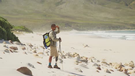 Sporty-mixed-race-man-with-prosthetic-leg-hiking