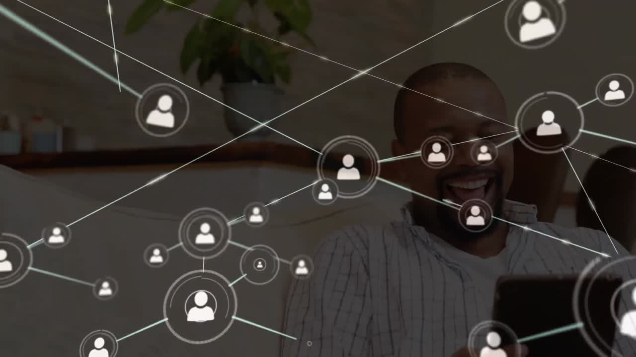 Animation of networks of connections with icons over man using tablet