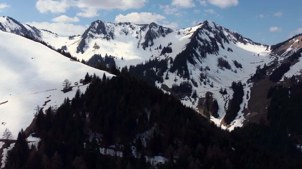 Drone fly above Torgon and revealing the Mountains, in Switzerland