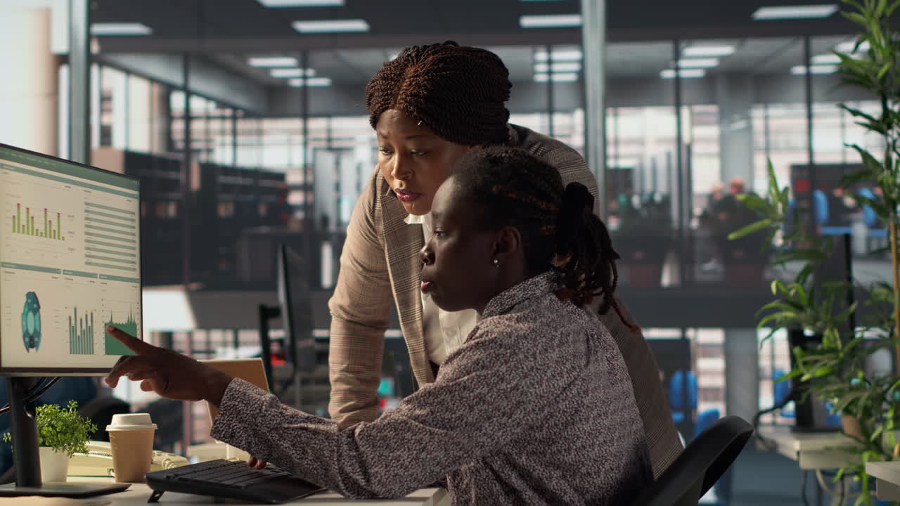 Businesswomen collaborating on data analysis