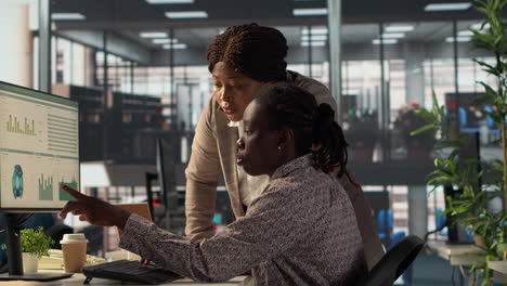 businesswomen collaborating on data analysis
