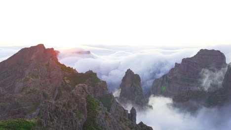 scenic madeira mountains and cliffs above low hanging clouds