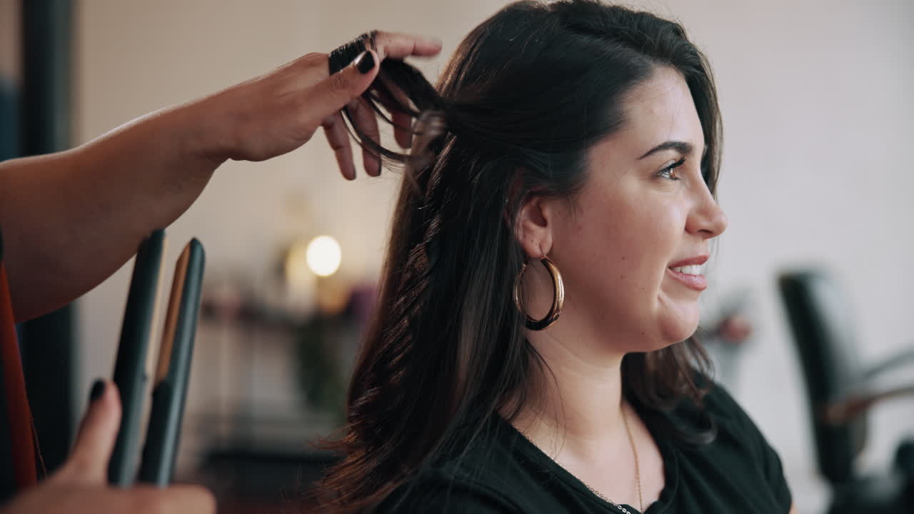 Happy Woman Getting Her Hair Styled in a Beauty Salon