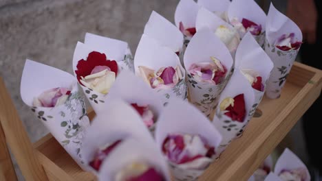 handmade paper cones filled with rose petals for wedding guests