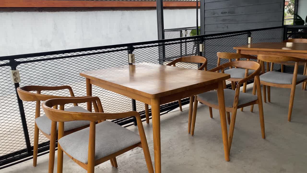 The footage shows the tables and chairs of customers of the concept coffee shop inside an aesthetic room.