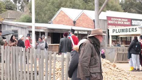 elderly couple explores a historical village setting