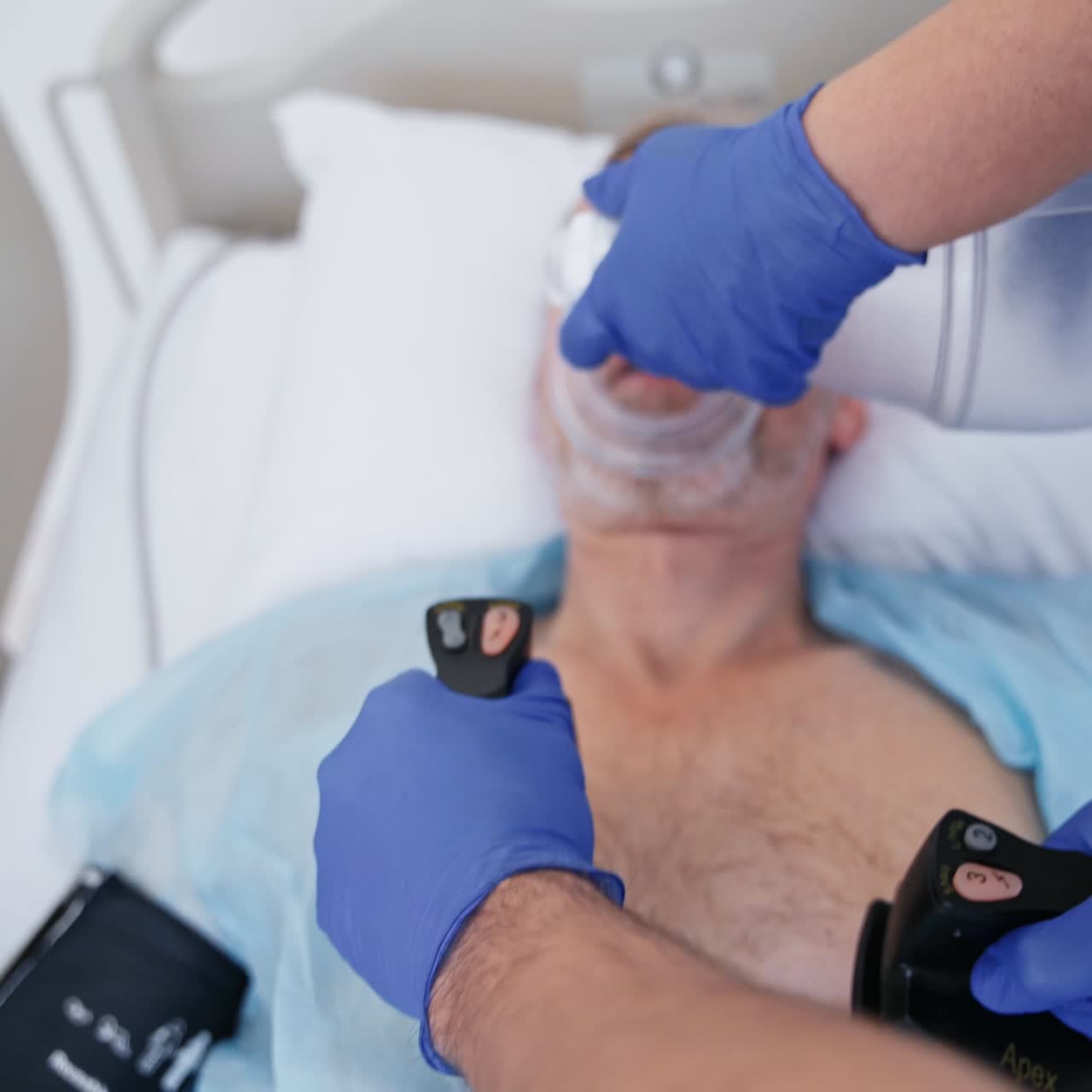 Doctor resuscitating patient in hospital