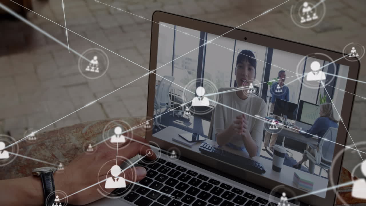 Animation of network of profile icons over rear view of man having a video call on laptop at cafe