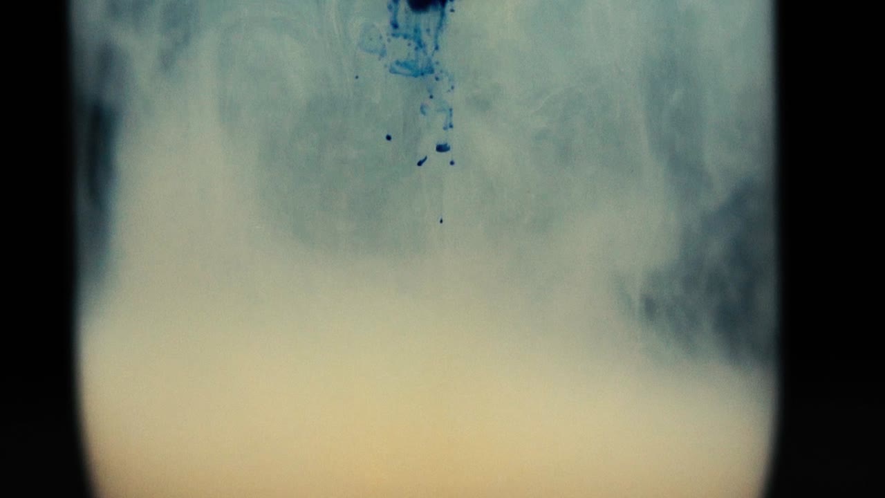 Colored paint floating in water tank. Stable shot with the Sony a7iii