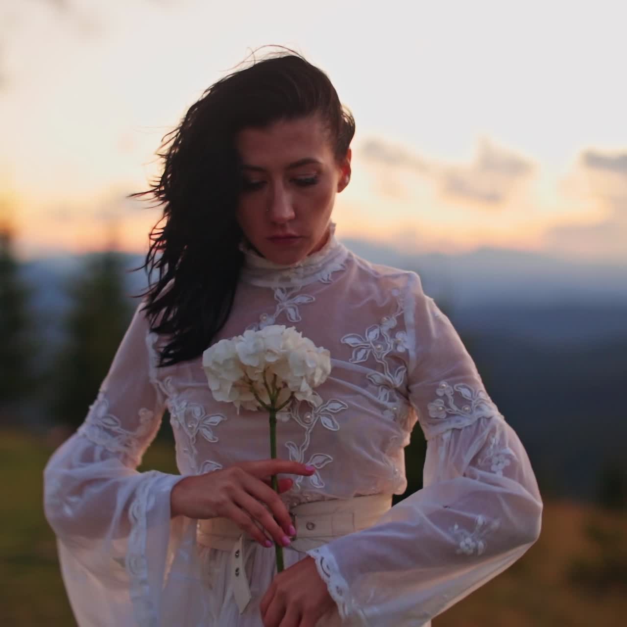 Beautiful lady in dress dancing on nature. Cheerful pretty woman walking on beautiful landscapes