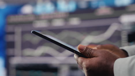 black male business leader in a digital environment focused on charts