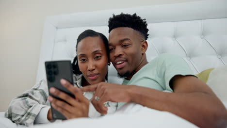 Relax,-bed-and-black-couple-on-a-phone-browsing