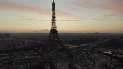 Aerial-footage-of-famous-tourist-attraction-in-European-metropolis.-Eiffel-Tower-near-Seine-river.-Paris,-France