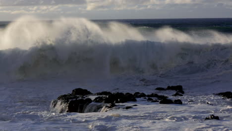 Windswept-waves-roll-into-a-beach-following-a-big-storm