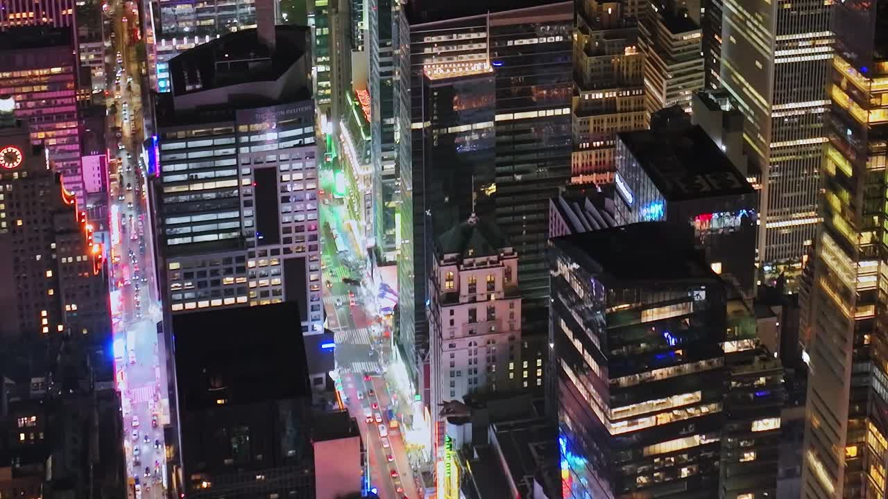 Bird's eye view of vibrant New York City street at night