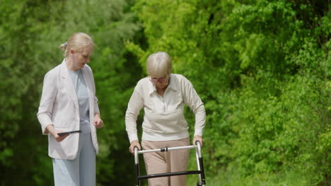 elderly woman receiving assistance while walking outdoors