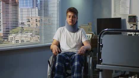 injured teenager in hospital wheelchair