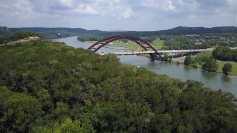 aerial reveal of pennybacker bridge and lake austin in austin, texas