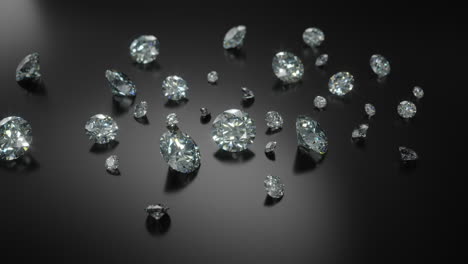 a group of different sized cut diamonds on rotating black shiny surface