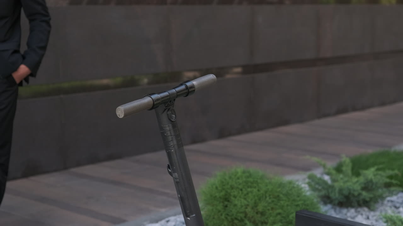 Businessman using an Electric Scooter
