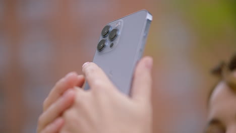 person holding a silver smartphone