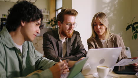 a business meeting taking place in a cafe