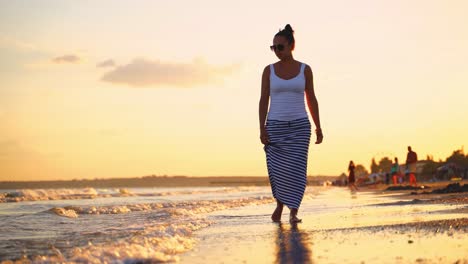 woman walking at the beach. young woman walking and relax on the beach