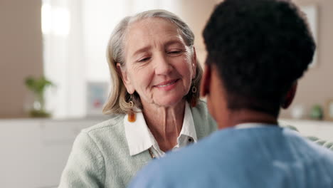 elderly woman receiving a comforting hug from caregiver