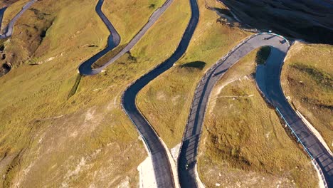 aerial view of motorcyclists riding fuscher torl pass on grossglockner scenic high alpine road, austria