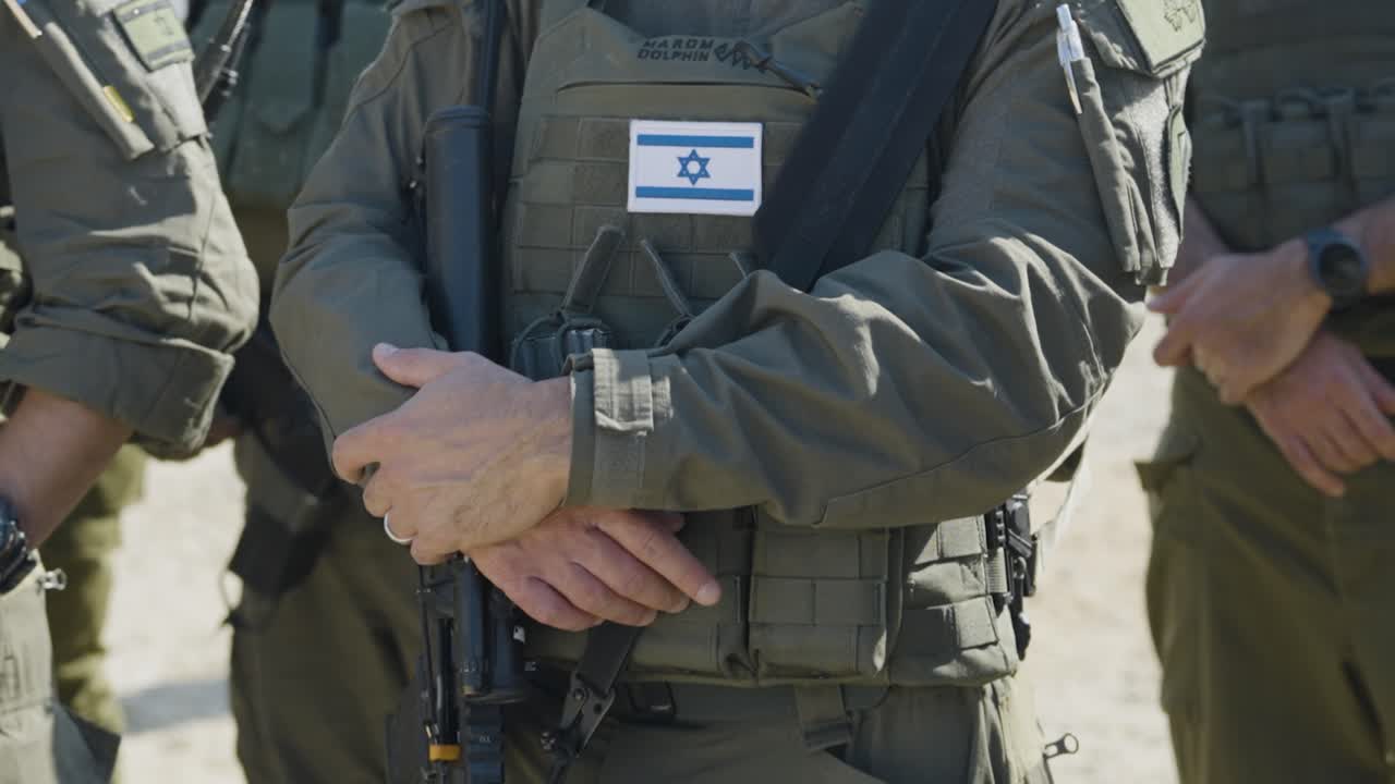 Half body video of Israeli soldier in line