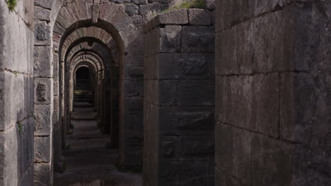 looking down a stone hallway in pergamum