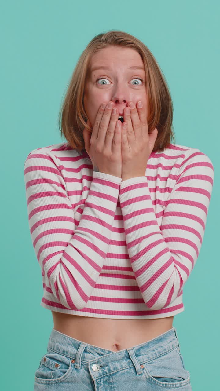 Excited amazed woman surprise looking at camera with big eyes shocked by sudden victory wow emotion