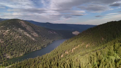 paul lake: a drone's journey over a pristine lake and forested mountains