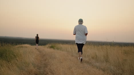 an active elderly woman is jogging catching up with her granddaughter