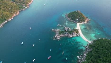 aerial establishing of nang yuan island and koh tao’s coastline, with vibrant turquoise waters, sandy beaches, and tropical greenery