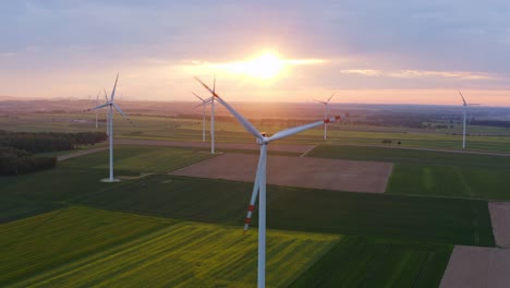 wind turbines against an amazing sunset - poland - aerial view