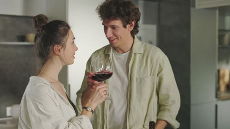 couple enjoying red wine at home