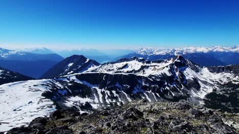 the amazing viewpoint of canadian mountain range in british columbia - wide pan reveal