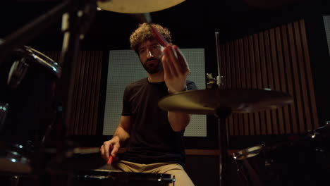 drummer rehearsing in concert hall. musician making melody in recording studio.