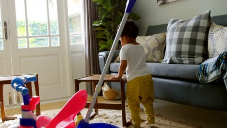 Side-view-of-little-black-boy-playing-in-a-comfortable-home-4k