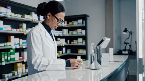 pharmacist working at the pharmacy counter