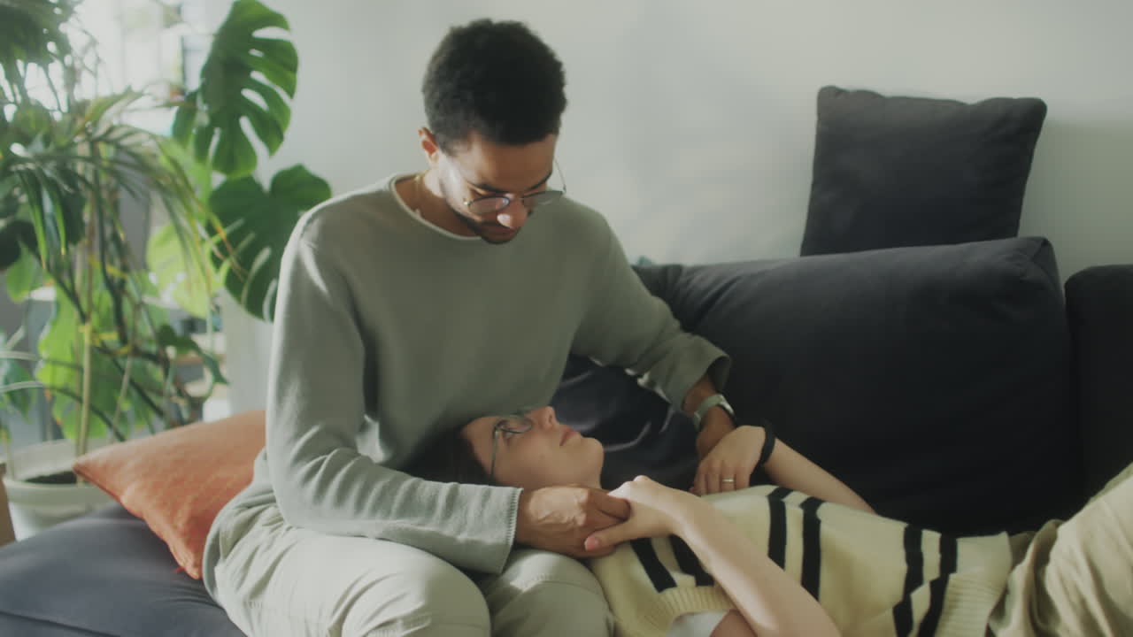 Romantic Couple Bonding on Sofa at Home