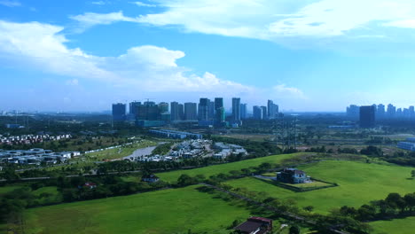 aerial shots of a landscape with green fields and homes